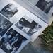 A memory book is seen on the curb, saved from a house in the Huron Farms subdivision in Dexter on Monday. Melanie Maxwell I AnnArbor.com